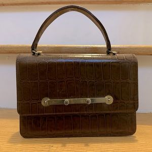 John Hort Vintage Clutch. The 2 buttons squeeze together to open it.